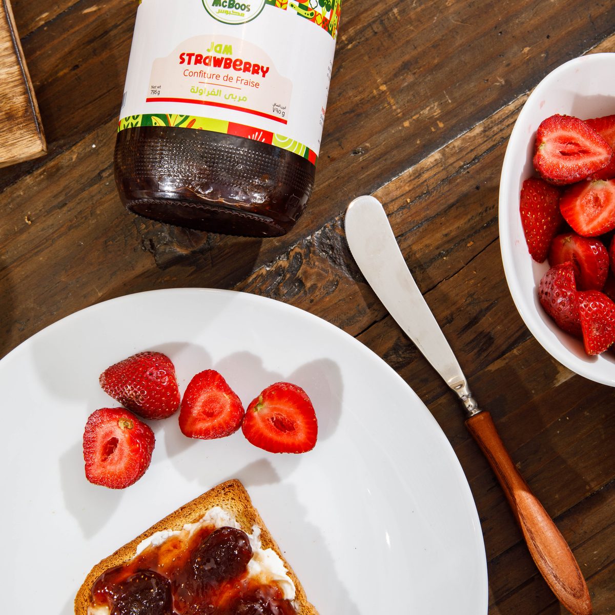 McBoos strawberry jam مربى الفراولة served on toast with fresh strawberries