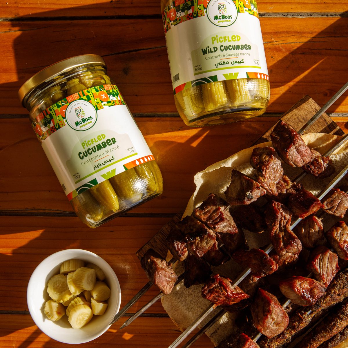 McBoos pickles مخللات served with grilled skewers